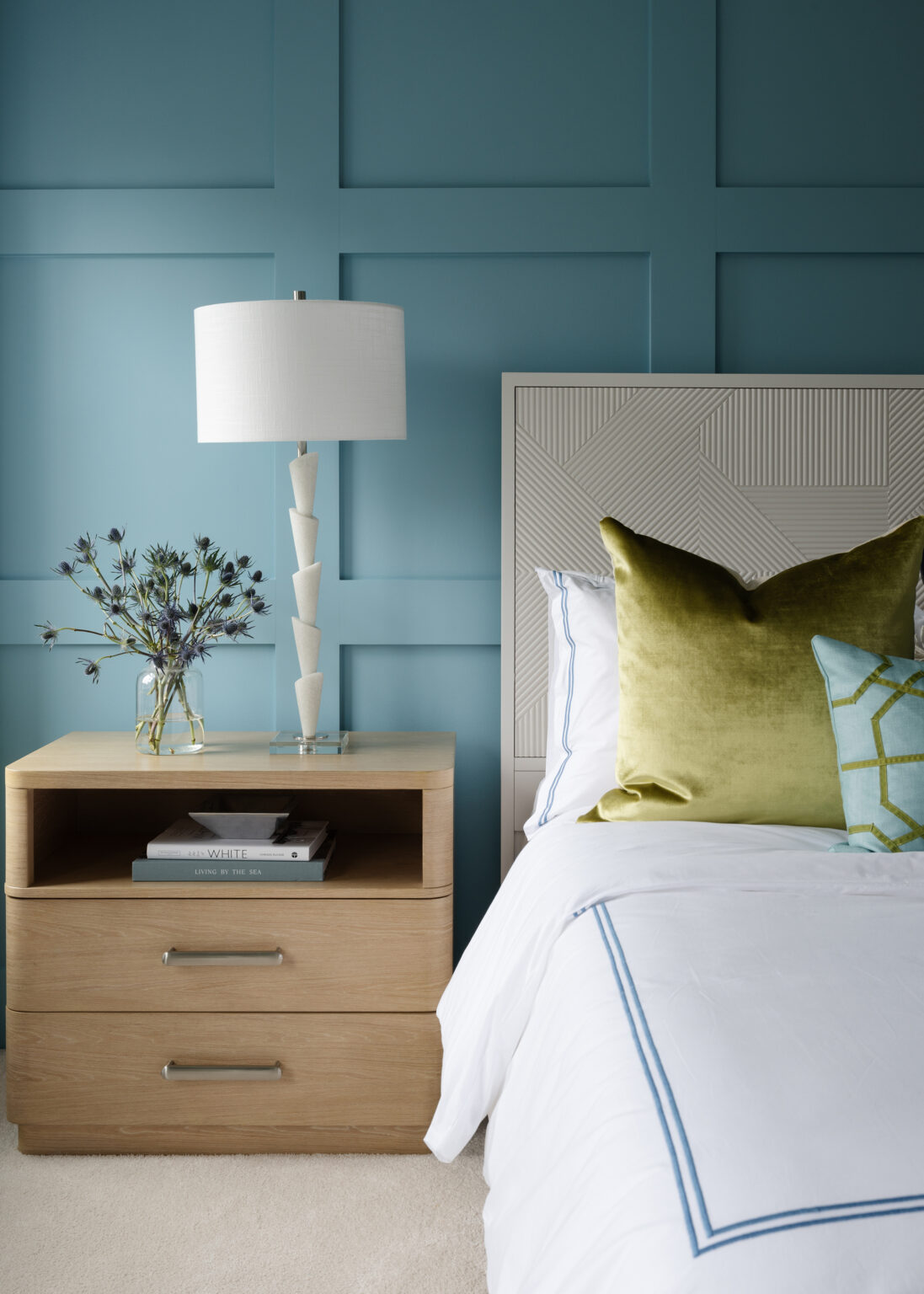 Blue paneled wall in guest bedroom